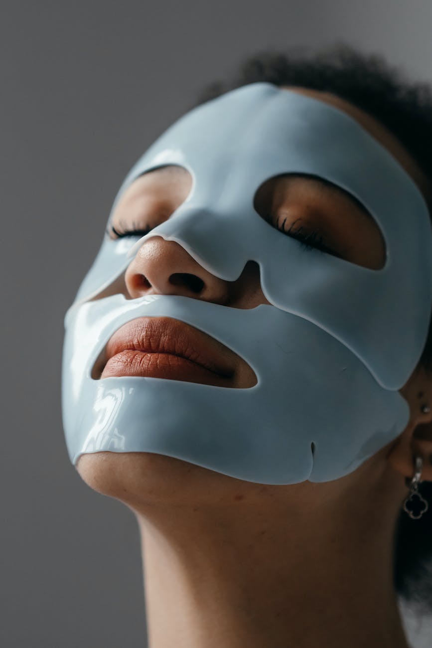 close up photo of a woman with facial mask
